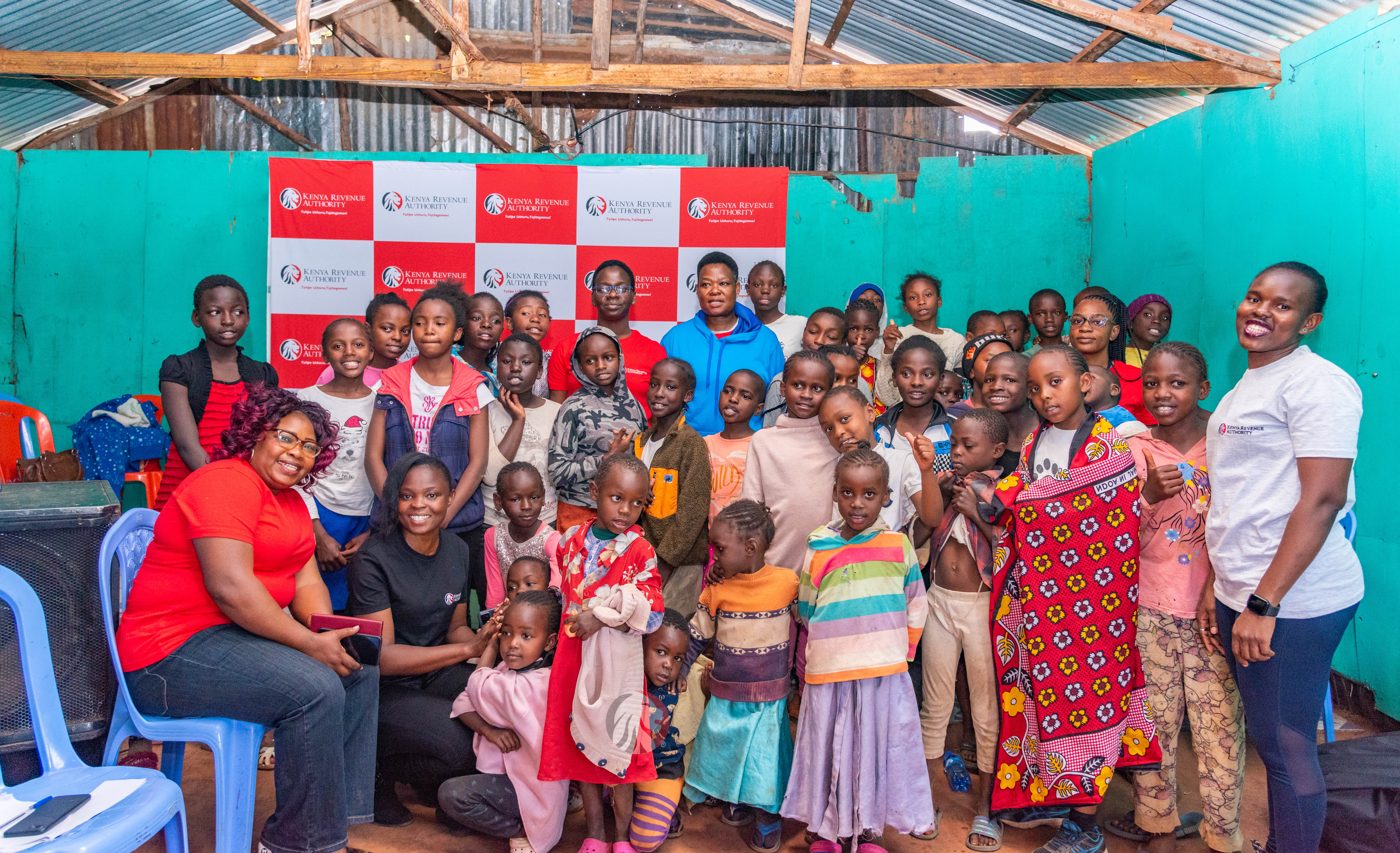 KRA mentorship inaugural session KRA mentors with primary school girls during the mentorship session in Soweto, Kibera in Nairobi